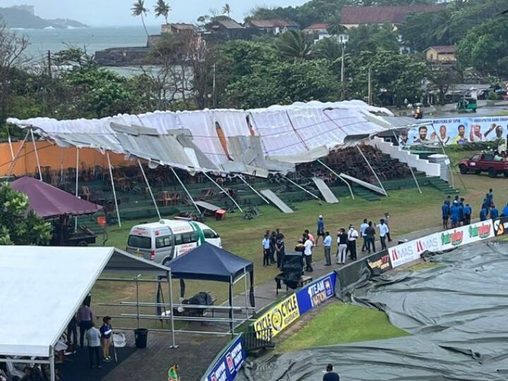 A stand collapsed in heavy rain and storm before the start of the second day's play between Sri Lanka and Australia at the Galle International Stadium Video, SL vs AUS: तेज बारिश और तूफान में उड़ा स्टेडियम का स्टैंड, वायरल हुईं तस्वीरें और वीडियो