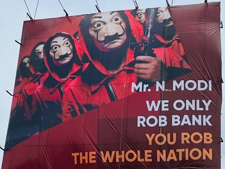 PM Narendra modi hyderabad visit Money Heist Banner placed PM modi hyderabad visit PM Modi Hyderabad Visit: பிரதமர் வருகைக்கு  எதிர்ப்பு; ஹைதராபாத்தில் வைக்கப்பட்ட மணி ஹைஸ்ட் பேனரால் பரபரப்பு