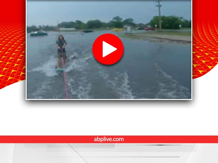 Florida teenager wakeboarding on flooded road video viral on social media Watch: बाढ़ के पानी में फ्लोरिडा की सड़क पर वेकबोर्डिंग करते लड़के का वीडियो वायरल