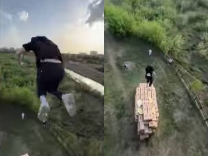 Man jumps off bridge dangerous stunt video viral on social media Stunt Video: शख्स ने सैकड़ों फीट ऊंचे पुल से लगाई छलांग, वीडियो देख कांप जाएगी रूह