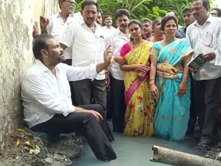 Andhra Pradesh YSRCP MLA Kotamreddy Sridhar Reddy Sits In Drain To Protest Against Sewage Problem - Watch Watch: YSRCP MLA Kotamreddy Sridhar Reddy Sits In Drain To Protest Against Sewage Problem