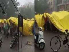 Watch Video : ’தார்ப்பாய் இருக்க கவலை ஏன் ‘ அடைமழையிலும் விடாது தொடரும் திருமண சடங்குகள் ! வைரல் வீடியோ!