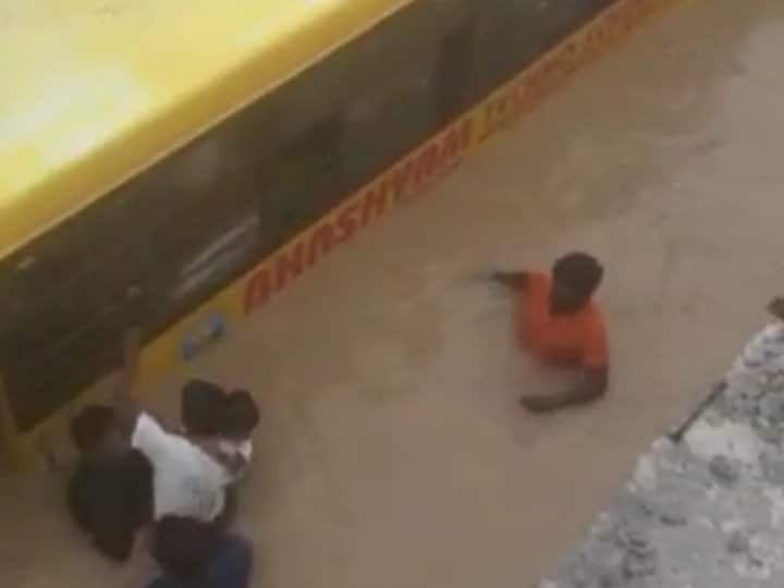 Telangana: School Bus Carrying 30 Students Partially Submerged in flood water in Mahabubnagar District Video School Bus Carrying 30 Children Gets Submerged In Waterlogged Underpass In Telangana | WATCH