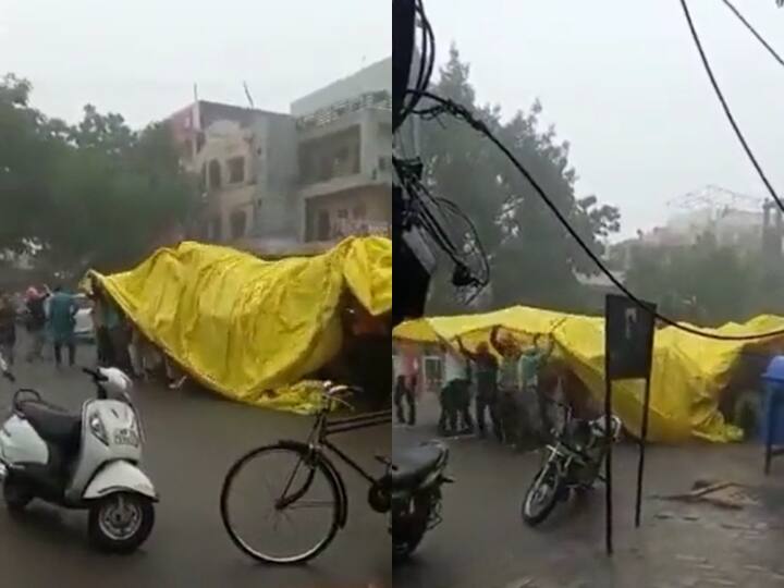 Video Baratis Use Giant Tarp To Shelter Themselves From Rain To Reach Destination On Time In Indore Madhya Pradesh Pradesi Pura Baraatis Use Giant Tarpaulin To Shelter Themselves From Rain To Reach Destination On Time - WATCH