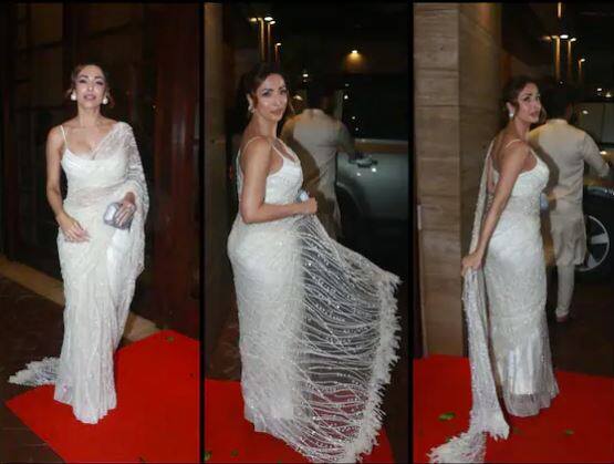 Malaika Arora white saree photos: ਬਾਲੀਵੁੱਡ ਦੀ ਛਈਆ-ਛਈਆ ਗਰਲ ਮਲਾਇਕਾ ਅਰੋੜਾ ਇੱਕ ਵਾਰ ਫਿਰ ਆਪਣੇ ਗਲੈਮਰਸ ਲੁੱਕ ਨੂੰ ਲੈ ਕੇ ਸੁਰਖੀਆਂ ਵਿੱਚ ਆ ਗਈ ਹੈ। ਫੈਸ਼ਨ ਦੀਵਾ ਮਲਾਇਕਾ ਇਕ ਇਵੈਂਟ 'ਚ ਸ਼ਾਮਲ ਹੋਣ ਲਈ ਘਰ ਤੋਂ ਨਿਕਲ ਰਹੀ ਸੀ। ਇੱਥੇ ਉਹ ਚਿੱਟੀ ਸਾੜੀ ਵਿੱਚ ਸ਼ਾਨਦਾਰ ਨਜ਼ਰ ਆਈ। ਸੋਸ਼ਲ ਮੀਡੀਆ 'ਤੇ ਮਲਾਇਕਾ ਦੀ ਚਿੱਟੀ ਸਾੜ੍ਹੀ 'ਚ ਇਹ ਤਸਵੀਰਾਂ ਸਾਹਮਣੇ ਆਈਆਂ ਹਨ।