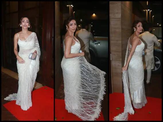 Malaika Arora white saree Photos: બૉલીવુડના છૈયા-છૈયા ગર્લ મલાઇકા અરોડા એકવાર ફરીથી પોતાના ગ્લેમરસ લૂક્સને લઇને ચર્ચામાં આવી છે. ફેશન ડીવા મલાઇકા અરોડા કોઇ ઇવેન્ટમાં સામેલ થવા માટે ઘરેથી નીકળી રહી હતી, અહીં તેનો વ્હાઇટ સાડીમાં સ્ટનિંગ લૂક જોવા મળ્યો. સોશ્યલ મીડિયા પર મલાઇકાની પાતળી વ્હાઇટ સાડીની તસવીરો વાયરલ થઇ રહી છે.