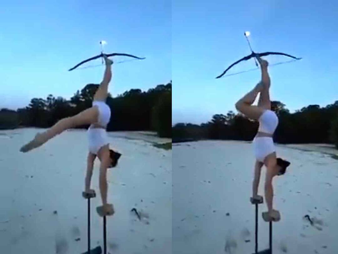 Trending Video : हातावर तोल सावरला अन् पायांनी निशाणा साधला! तरुणीची तिरंदाजी पाहून नेटकरी झाले अवाक् A girl doing archery with the help of feets video goes viral on social media Trending Video : हातावर तोल सावरला अन् पायांनी निशाणा साधला! तरुणीची तिरंदाजी पाहून नेटकरी झाले अवाक्