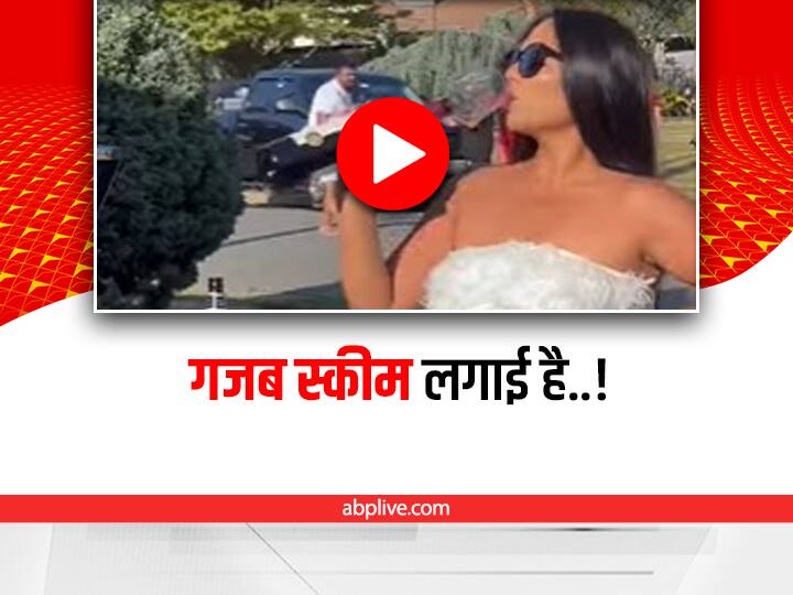 woman put one glass on red wine bottle video viral on social media Funny: डॉक्टर ने कहा- दिन में सिर्फ एक गिलास वाइन पीनी है, महिला ने निकाली तरकीब