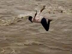 நிரம்பி வழியும் ஆற்றில் டைவ் அடித்த இளைஞர்... விளையாட்டே விபரீதமான கதை - பதைபதைக்கும் வீடியோ!