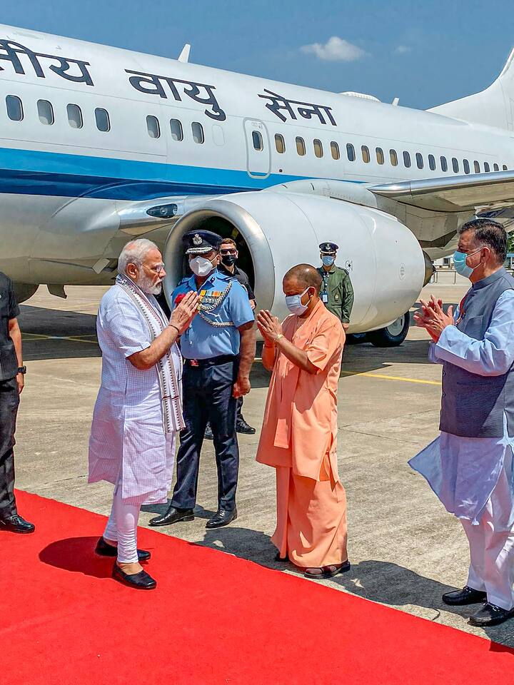 Prime Minister Narendra Modi is received by UP CM Yogi Adityanath on his arrival in Kanpur. (Image Source: PTI)