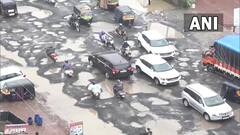 गुजरातमध्ये पावसामुळे खड्ड्यात रस्ता...नॅशनल हाय वे-48 चे फोटो पाहा