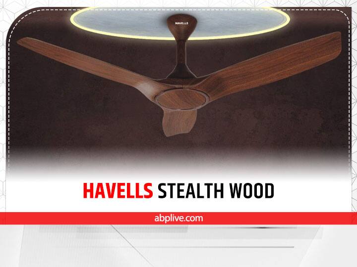 हैवल्स स्टैल्थ वुड (Havells Stealth Wood) सबसे बेहतरीन सजावटी पंखों में से एक है. यह धांसू फीचर्स के साथ आता है. इसके खास फीचर्स में स्मार्ट कनेक्टिविटी और लो-नॉइज ऑपरेशन शामिल है. यह वुड फिनिश डिजाइन से लैस है. यह फैन कमरे का तापमान कम करने में सक्षम है. इसके साथ ही यह नमी को बाहर फेंकता है. 78 वाट बिजली खपत के साथ यह स्मार्ट सीलिंग फैन 15,715 रुपये की कीमत में उपलब्ध है.
