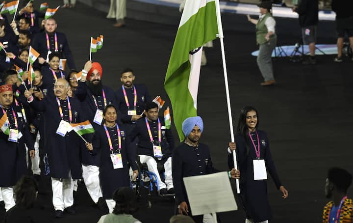 Joint- flagbearers PV Sindhu and Manpreet Singh lead the Indian contingent during the opening ceremony of Commonwealth Games 2022 (CWG), at the Alexander Stadium in Birmingham, UK. (Image Source: PTI)