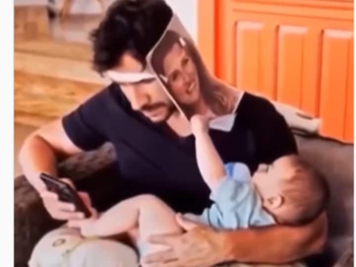 Viral Video Dad pampers baby with fake mother photo video goes viral- watch Watch Video: அடேய்.. தகப்பா! செல்போனால் சிக்கிக்கொண்ட தந்தை.. சுட்டிக்குழந்தையின் வைரல் வீடியோ!