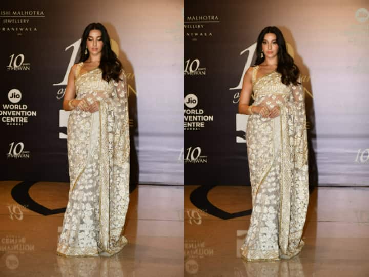 Nora Fatehi was spotted in a golden off white sheer saree. Nora graced the Mijwan fashion show 2022 where Deepika Padukone and Ranveer Singh were showstoppers for Manish Malhotra's fashion show.