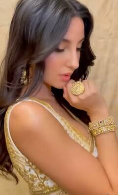 Nora Fatehi Pics: ऑफ व्हाइट साड़ी पहन कहर ढाती दिखीं नोरा फतेही, खूबसूरत अदाओं ने चुराई फैन्स की नींदें