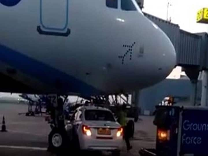 Go First Car Passes Under IndiGo Plane, Narrowly Avoids Collision With Nose Wheel viral video DGCA Delhi IGI Go First Car Narrowly Avoids Collision With Indigo Aircraft At Delhi Airport. WATCH