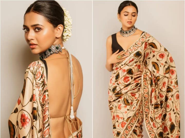 Tejasswi Prakash is a sight to behold in a beautiful floral printed saree paired with black backless blouse.