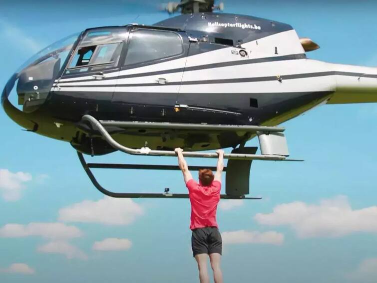 fitness influencer breaks Guinness World Record by doing pull ups from helicopter Watch Video:  பறக்கும் ஹெலிகாப்டரில் தொங்கி புல் அப்ஸ்! கின்னஸ் சாதனை படைத்த யூட்யூபர்