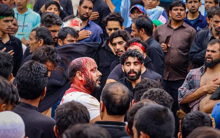 Shia Muslims during a religious procession on the tenth day of Muharram, which marks the day of Ashura, in Jammu & Kashmir's Poonch area. Authorities had even imposed curfew-like restrictions in parts of the Srinagar on Sunday to prevent members of te Shia community from taking out Muharram processions on the eighth day of the 10-day mourning period. (Image: PTI)