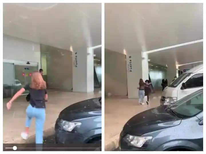 Girl running to embrace her boyfriend at the airport but they slipped badly funny video viral social media Watch: ગર્લફ્રેન્ડને મળવા દોડી યુવતી અને અચાનક આવું થયું કે બધા જ ચૌંકી ગયા,વીડિયો થયો વાયરલ