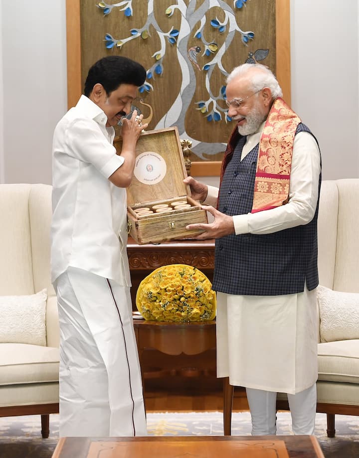 CM Stalin presented a box comprising a collection of traditional rice and small grain varieties of Tamil soil. (Image: Twitter/Tamil Nadu CMO)