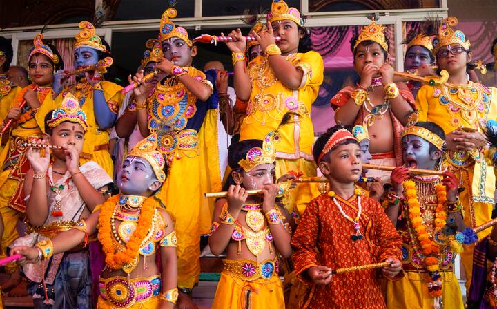 Children dressed up as Lord Krishna pose during a competition ahead of the upcoming festival of Janmashtami, in Bhubaneswar. (Image: PTI)