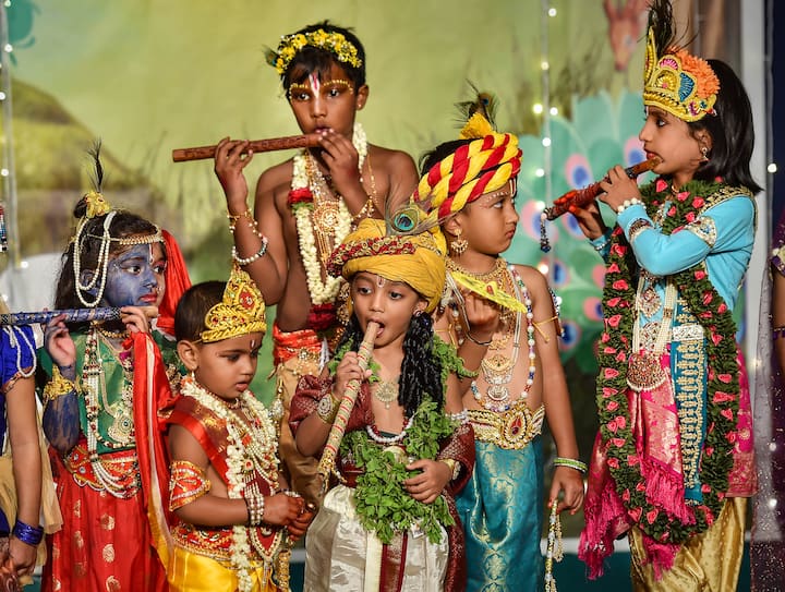 Children dressed as Lord Krishna and Goddess Radha during a fancy dress competition on the occasion of 'Krishna Janmashtami' festival, at ISKCON temple in Bengaluru. (Image: PTI)