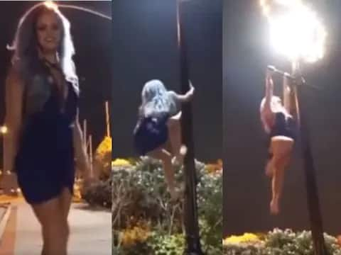 model like woman climb on street light to do pull up viral video Watch: ਖੂਬਸੂਰਤ ਕੁੜੀ ਨੇ ਸੜਕ 'ਤੇ ਚਲਦੇ ਹੋਏ ਕੀਤਾ ਅਜਿਹਾ ਸਟੰਟ, ਦੇਖ ਕੇ ਹੋ ਜਾਓਗੇ ਹੈਰਾਨ! ਵੀਡੀਓ ਹੋ ਰਿਹਾ ਹੈ ਵਾਇਰਲ