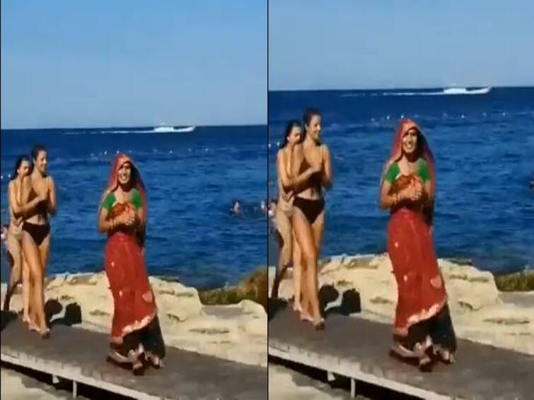 Video: Among Bikini-Clad Tourists, Woman's Beach Stroll In Saree video: பிகினி உடையில் இருக்கும் பெண்களுக்கு  மத்தியில் கலாச்சார உடை அணிந்த இந்திய பெண் ! வைரல் வீடியோ!