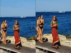 video: பிகினி உடையில் இருக்கும் பெண்களுக்கு மத்தியில் கலாச்சார உடை அணிந்த இந்திய பெண் ! வைரல் வீடியோ!