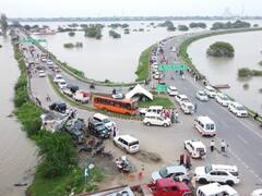 हमीरपुर में बाढ़ के बीच पहुंचे यूपी सरकार के दो मंत्री, कहा-किसानों को देंगे मुआवजा, लोगों ने की ये मांग