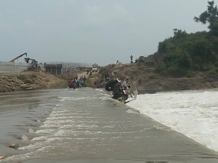 Ujjain two people including tractor crossing culvert of Gambhir river