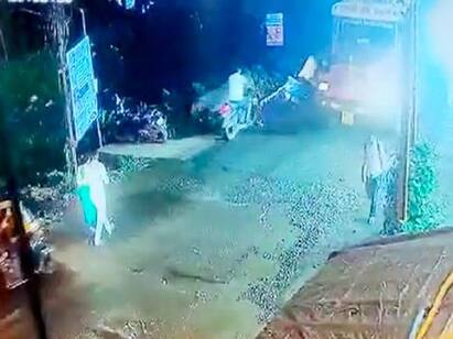 Video Truck Runs Over Biker After He Loses Balance Due To Pothole Video : குண்டும் குழியுமாய் இருந்த சாலை...கட்டுப்பாட்டை இழந்த பைக் ஓட்டுநர்...எதிரில் லாரி...ஷாக் வீடியோ