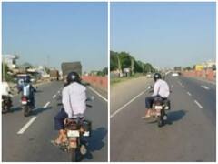 Stunt Video: ਵਿਅਸਤ ਸੜਕ 'ਤੇ ਜਾਨਲੇਵਾ ਸਟੰਟ ਕਰਦੇ ਦੇਖਿਆ ਗਿਆ ਇੱਕ ਵਿਅਕਤੀ, ਹੱਥ ਛੱਡ ਕੇ ਖਤਰਨਾਕ ਤਰੀਕੇ ਨਾਲ ਚਲਾਈ ਬਾਈਕ