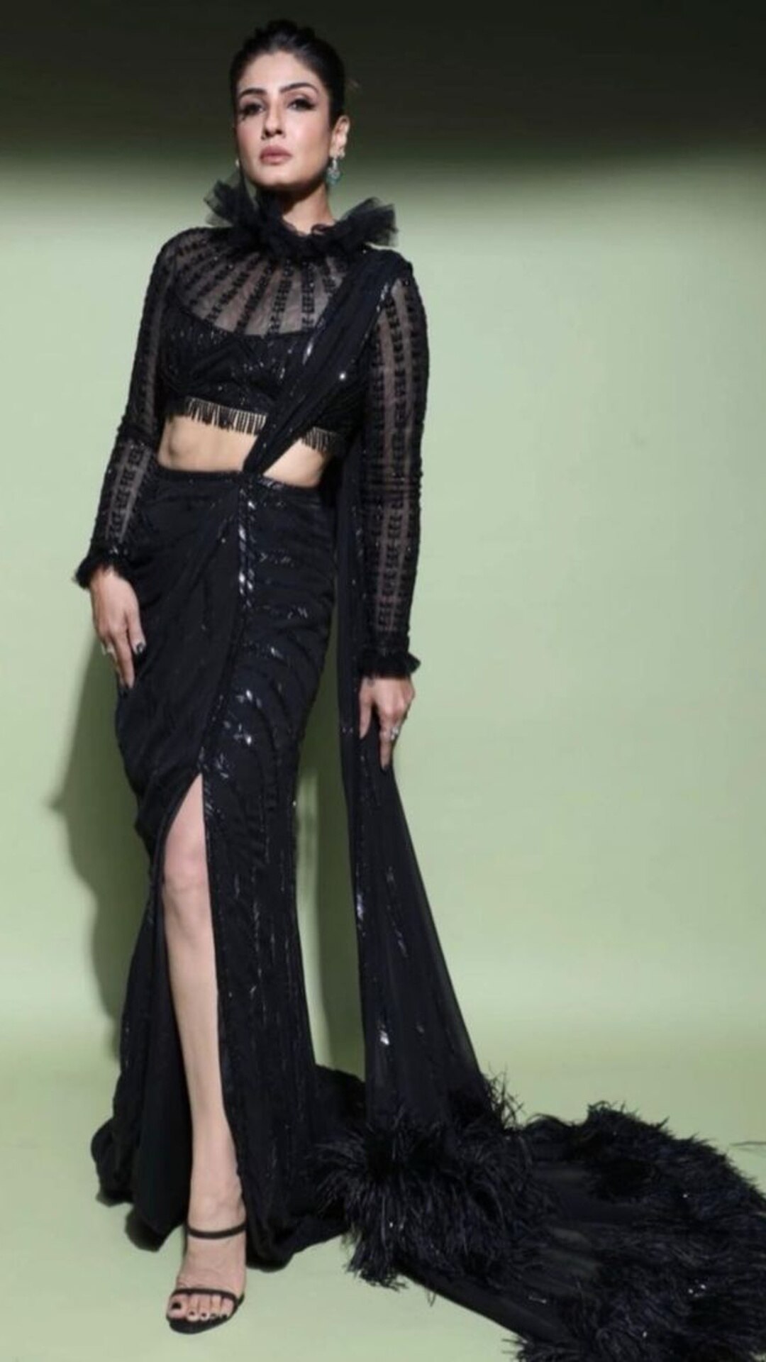 Raveena glowed in a black chiffon saree by Manish Malhotra.
