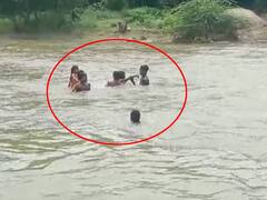வெள்ளத்தில் அடித்து செல்லப்பட்ட சிறுமிகள்; போராடி மீட்ட இளைஞர்கள் - அதிர்ச்சி வீடியோ