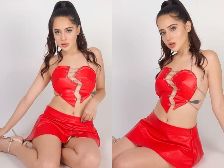 Uorfi Javed is known for going out of the box in terms of fashion. This time, she is turning heads in a red hot faux leather skirt and top, depicting a broken heart.