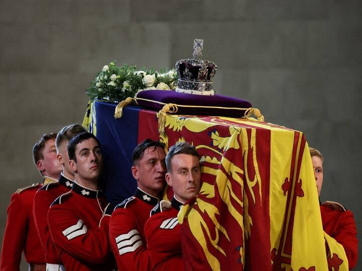 An escort of two officers and 32 troops from the 1st Battalion Grenadier Guards in red uniforms and bearskin hats walked on on either side of the gun carriage. Big Ben tolled, a gun salute boomed from Hyde Park and the martial strains of a military band accompanied the procession. (Source: PTI)