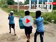Viral Video: रीवा में शिक्षक द्वारा बच्चों से पानी का भारी कंटेनर उठवाने का वीडियो हो रहा वायरल, आपने देखा क्या