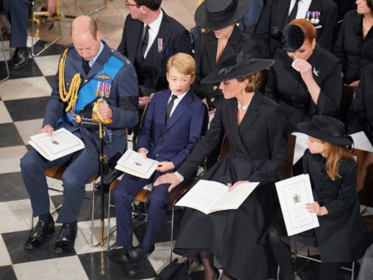 (Left to right) Britain's Prince William, Prince of Wales, his son Britain's Prince George, Britain's Catherine, Princess of Wales, and their daughter Britain's Princess Charlotte took their seats inside Westminster Abbey on September 19, 2022