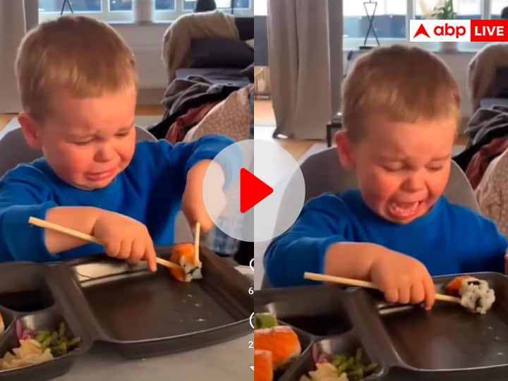 baby boy after failing eating from chopsticks starts crying cute viral video on social media Viral Video: चॉपस्टिक से खाना नहीं खा पा रहा था बच्चा तो रोने लगा, यूजर्स बोले- हाथ से खा लो