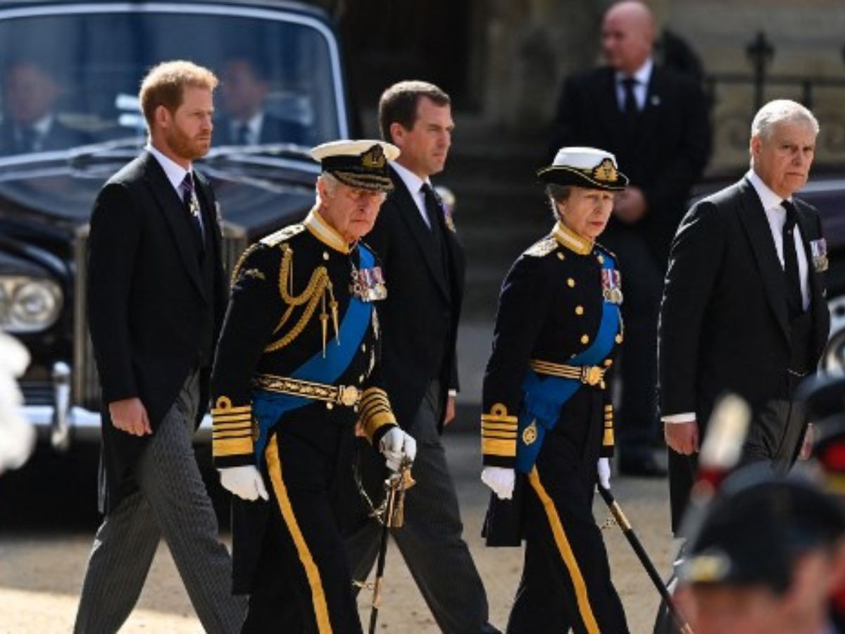 The image shows (from left to right) Britain's Prince Harry, Duke of Sussex, Britain's King Charles III, Britain's Anne, Princess Royal and Britain's Prince Andrew, Duke of York, following the coffin of Queen Elizabeth II, draped in the Royal Standard with the Imperial State Crown and the Sovereign's orb and spectre, as the coffin left Westminster Abbey after the State Funeral of Britain's longest-reigning monarch on September 19, 2022.
