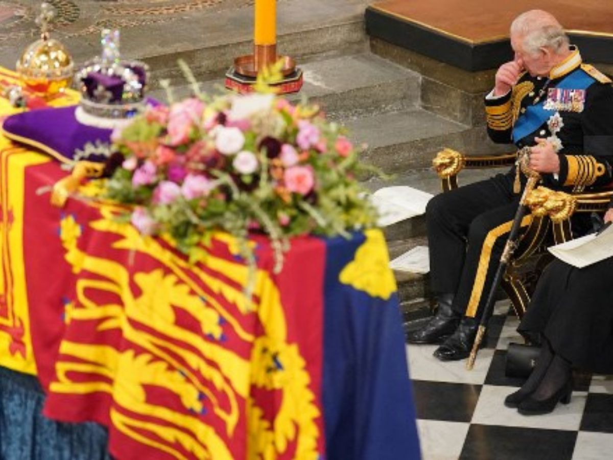 King Charles in front of Queen Elizabeth II's coffin
