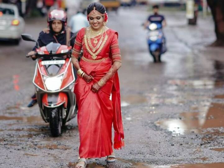 Viral Video Kerala Bride Walks On Road Full Of Potholes For Photoshoot Viral Video: గుంతలు పడ్డ రోడ్డుపై ఫోటో షూట్, ఈ అమ్మాయి ఐడియా అదుర్స్