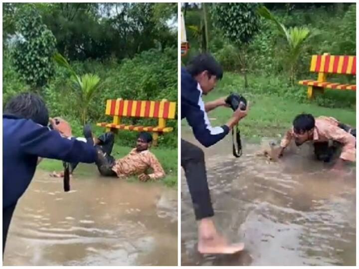 man jumped on road filled with water funny photoshoot Video Viral Funny Video: सड़क पर भरा पानी तो उसमें कूद-कूद कर शख्स ने दिए पोज, यूजर्स बोले- पागलपन