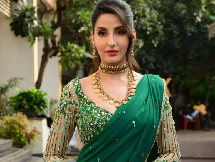 Nora fatehi looking gorgeous in green marathi saree  Nora fatehi saree: નોરા ફતેહીનો સાડીમાં જોવા મળ્યો ગ્લેમરસ અંદાજ, જુઓ વીડિયો