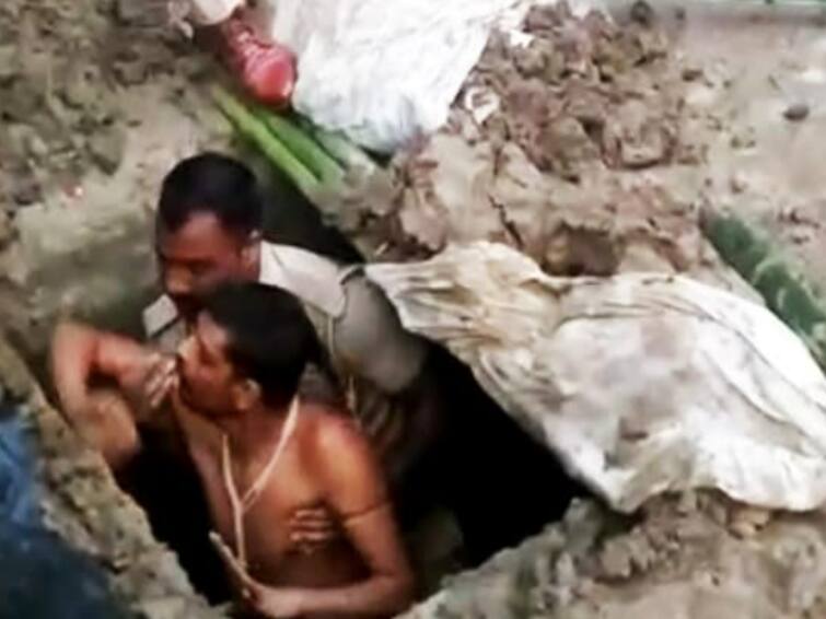 Taking Samadhi Buried 7 Feet Under UP Cops Rescue Man - Watch video Watch video: ’உயிருடன் சமாதி ஆனால், ஞானம் பெறுவாய்”.. தூண்டிய சாமியார்கள்.. துணிந்து குழிக்குள் படுத்த இளைஞர்..!