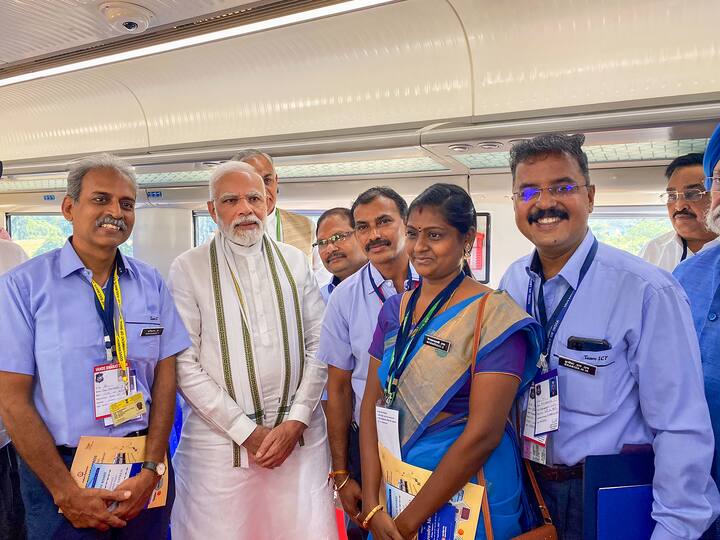 Prime Minister Narendra Modi with railway officials aboard the Vande Bharat Express from Gandhinagar to Ahmedabad. (Source: PTI)