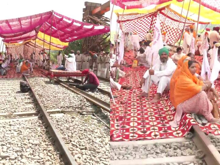 Punjab Farmers under the aegis of the Kisan Mazdoor Sangharsh Committee hold rail roko agitation Lakhimpur Kheri incident Lakhimpur कांड की बरसी पर पंजाब में रेल की पटरियों पर बैठे किसान, तीन घंटे के लिए ट्रैक जाम